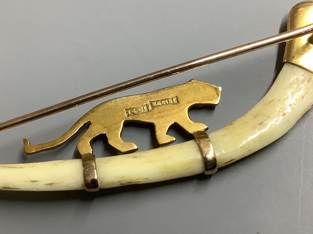 An Indian 14ct and bone mounted 'tiger' set curved brooch, by Hamilton & Co, in original box